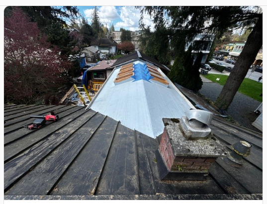 Before: Vancouver character home during standing seam metal roof replacement by Roofking, with membrane and trim work in progress