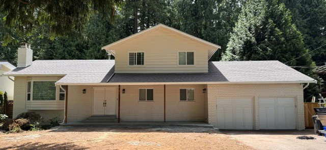 Residential home with a newly installed architectural shingle roof by Roofking in Langley, BC