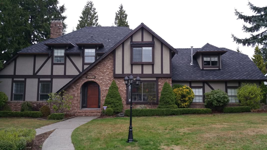 Tudor home with new dark architectural shingles — Roofking project in Surrey, BC
