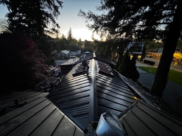 Standing seam metal roof at dusk — Roofking project in Langley, BC